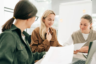 Business colleagues working at office