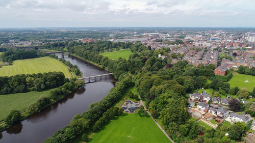 High angle view of trees and buildings against sky