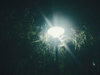 Low angle view of illuminated lights at night