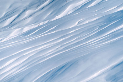 Waves patterns on snowcapped landscape