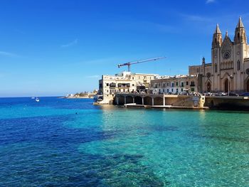 Scenic view of sea against blue sky