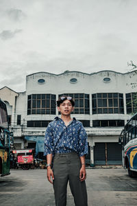 Young man standing in city