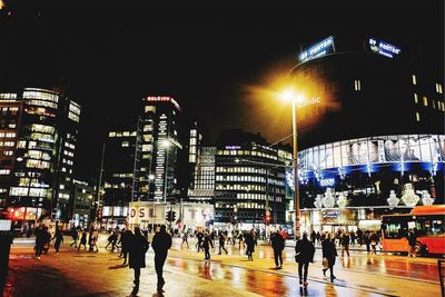 People in city at night