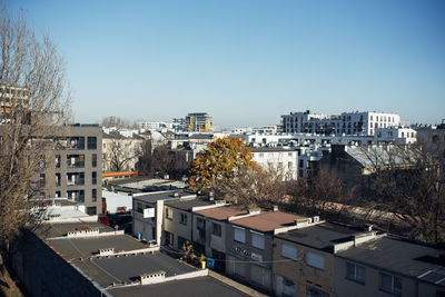 High angle view of buildings in city against clear sky