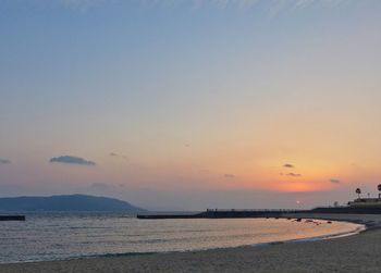 Scenic view of sea against clear sky during sunset