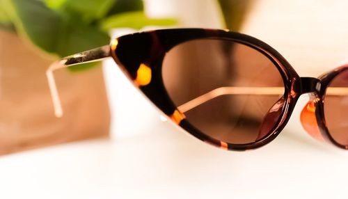 Close-up of sunglasses on table