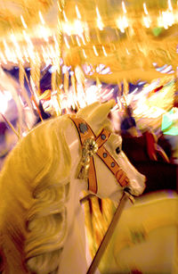 Close-up of illuminated carousel in amusement park