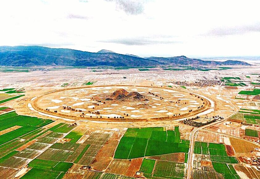 sky, aerial view, cloud - sky, nature, environment, landscape, day, architecture, outdoors, built structure, no people, high angle view, beauty in nature, scenics - nature, transportation, green color, land, mountain, agriculture, plant