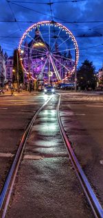 View of illuminated ferris wheel at night
