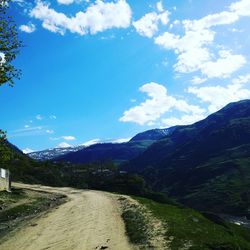 Scenic view of landscape against blue sky