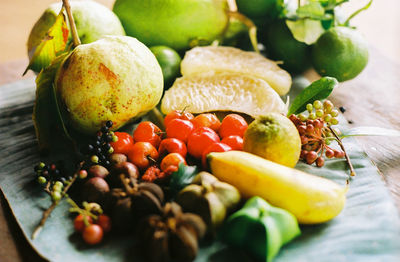 Close-up of fruits in plate on table