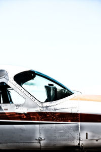 Close-up of airplane against clear sky