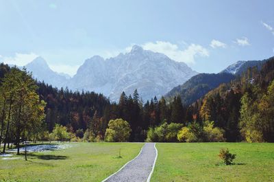 Beautiful road to the autumn snowcovered slovenian alps mountains.