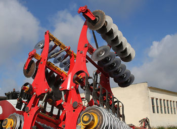 Low angle view of machinery against sky