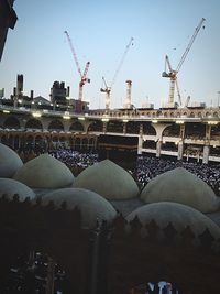 Low angle view of crane against clear sky