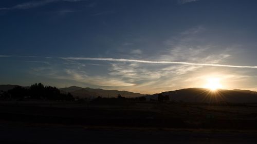 Scenic view of silhouette landscape against sky during sunset