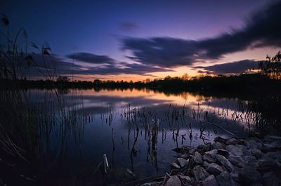 Scenic view of lake at sunset