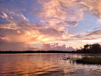 Scenic view of lake against sky during sunset