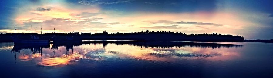 Scenic view of lake at sunset