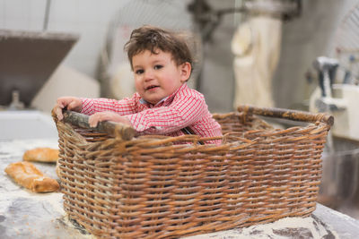 Cute boy looking away in basket