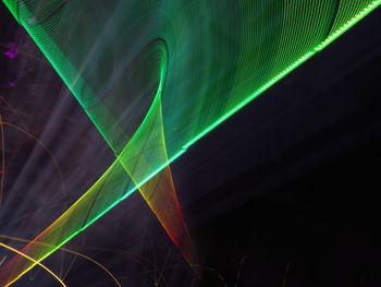 Close-up of light painting against black background