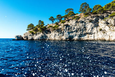 Scenic view of sea against clear blue sky