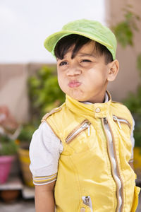 Portrait of boy standing outdoors