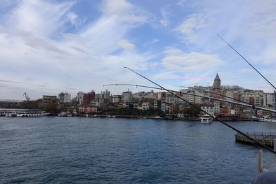 View of commercial dock by river against sky