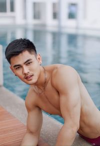 Portrait of young man in swimming pool