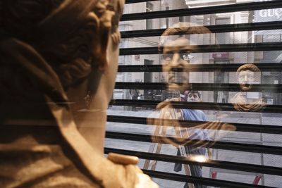 Reflection of people on glass window