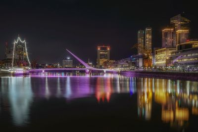 Illuminated buildings at waterfront