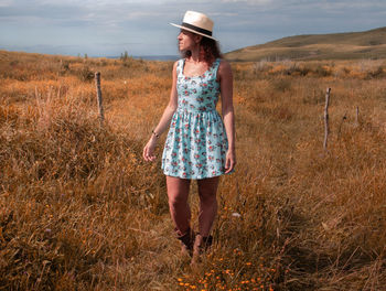 Full length of woman standing on field