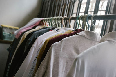 Close-up of clothes hanging on rack