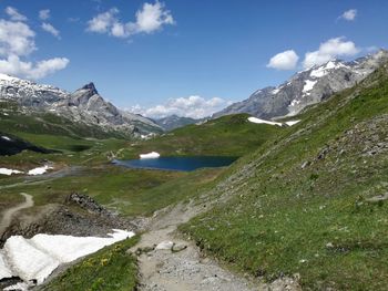 Scenic view of mountains against cloudy sky