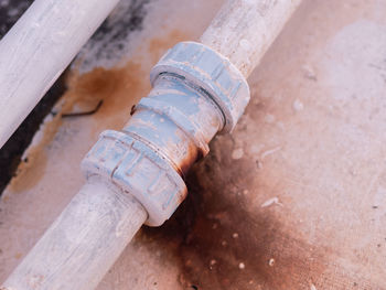 High angle view of metallic structure by pipe