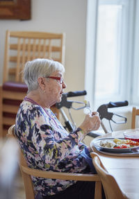 Senior woman having lunch