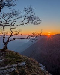 Scenic view of mountains against sky during sunset