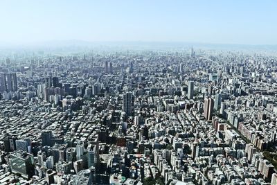 High angle view of modern buildings in city against sky