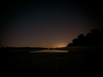 Scenic view of silhouette against clear sky at night