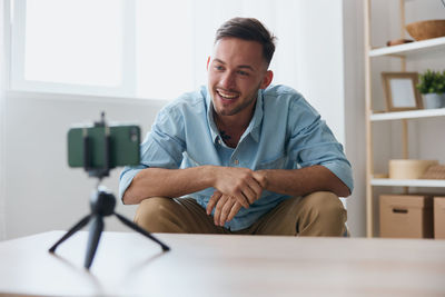 Portrait of young man working at home