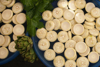 High angle view of artichokes in plate on table