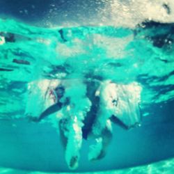 People swimming in sea