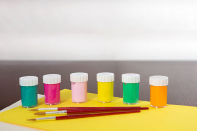 Close-up of multi colored pencils on table