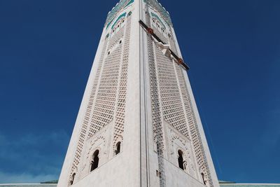 Low angle view of built structure against clear blue sky