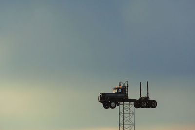 Low angle view of communications tower against clear sky