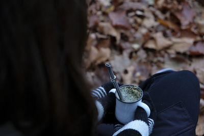 High angle view of woman having drink