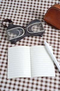 High angle view of open book on table