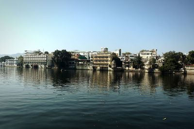 Buildings in city against clear sky