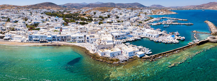 High angle view of sea and buildings in city