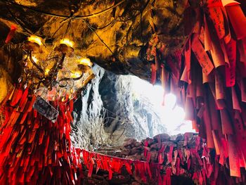 Low angle view of illuminated lanterns hanging in temple